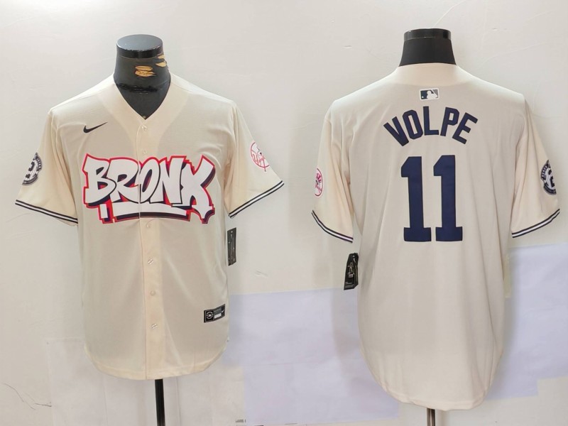 Personalized Men’s New York Yankees #11 Anthony Volpe Cream The Bronx Graffiti V2 Limited Stitched Baseball Jerseys